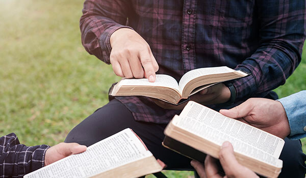 3 men doing a Bible study 