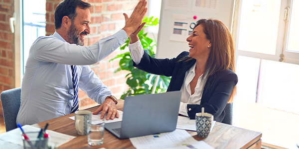financial image people high fiving 