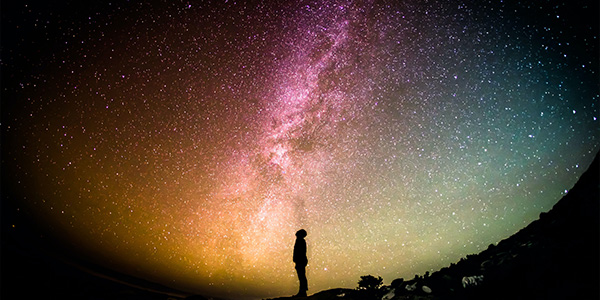 guy gazing up at starry sky