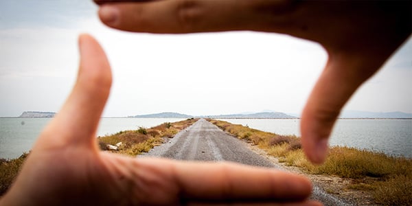 road framed in hands